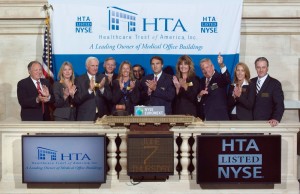 Scott D. Peters (center) and other Healthcare Trust of America Inc. dignitaries celebrated the firm’s New York Stock Exchange listing last June 7, but avoided the fanfare of an IPO, in part to so they wouldn’t dilute the holdings of existing shareholders. (Photo courtesy of Healthcare Trust of America Inc.)