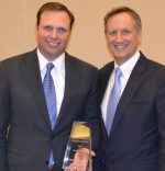 Jason Signor (left, shown with HREI Editor John B. Mugford) received his HREI Insights Awards™ award at the RealShare conference in Scottsdale, Ariz., in December. (HREI photo)