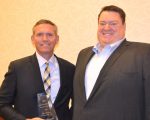 John Thomas (left) received his HREI Insights Awards™ Healthcare Real Estate Executive of the Year Award at the RealShare conference in Scottsdale, Ariz., in December. He is pictured above with the 2015 winner, Erik Tellefson of Capital One. (HREI photo)