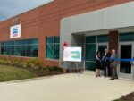Officials cut the ribbon in front of QIAGEN's facility in Ballenger Creek on July 9.