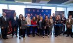 Group cutting the ribbon together